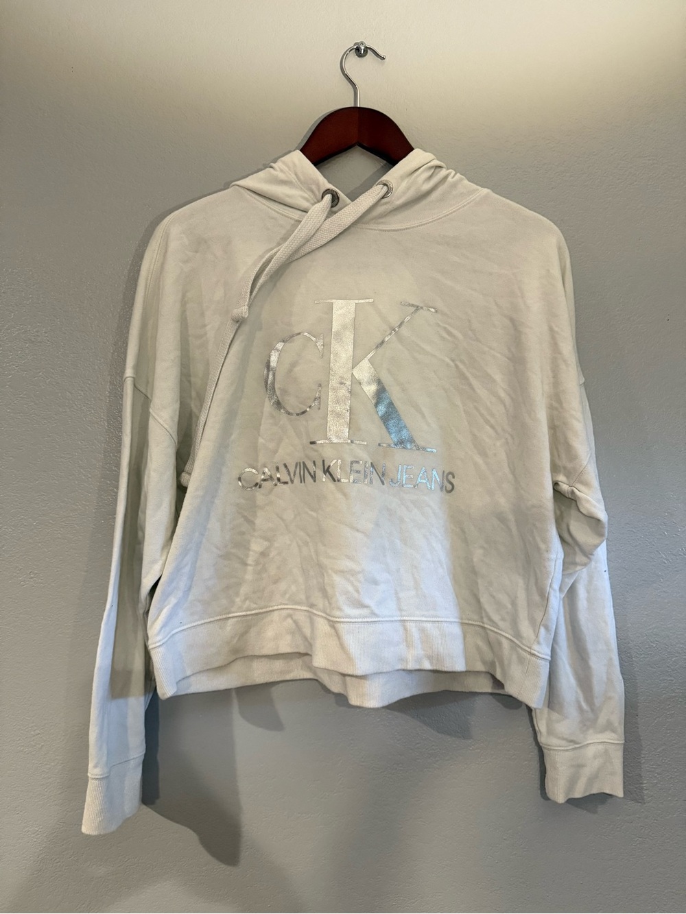 Calvin Klein Jeans Cream Hoodie with Black Logo Tag